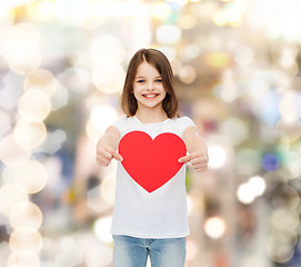 Image showing beautiful little girl sitting at table