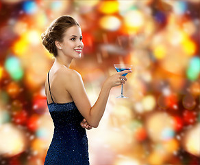 Image showing smiling woman holding cocktail