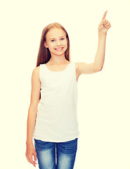 Image showing girl in blank white shirt pointing to something