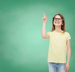 Image showing smiling cute little girl in black eyeglasses