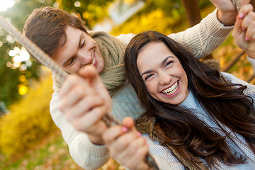 Image showing smiling couple hugging in autumn park