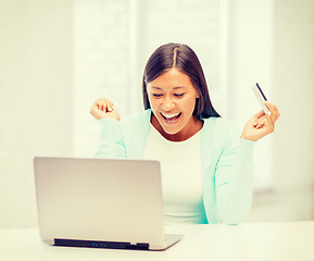 Image showing businesswoman with laptop and credit card