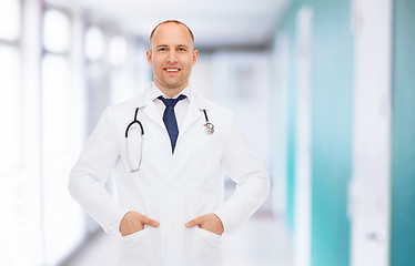 Image showing smiling male doctor in white coat with stethoscope