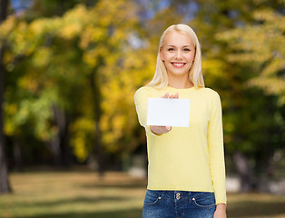 Image showing smiling girl with blank business or name card