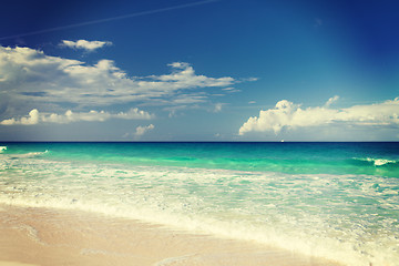 Image showing blue sea or ocean, white sand and sky with clouds