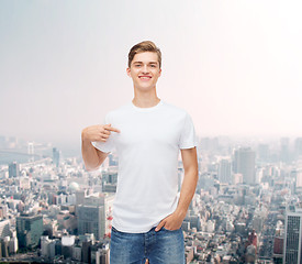 Image showing smiling young man in blank white t-shirt