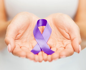 Image showing hands holding purple awareness ribbon