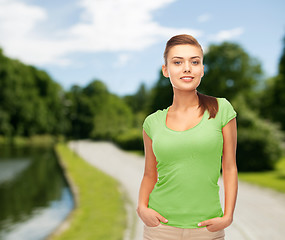 Image showing smiling young woman in blank green t-shirt