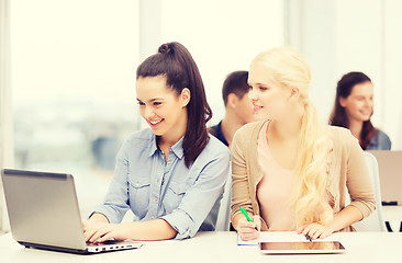 Image showing students with laptop, tablet pc and notebooks