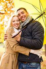 Image showing smiling couple hugging in autumn park