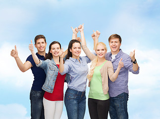 Image showing group of smiling students showing thumbs up