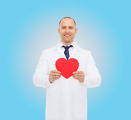 Image showing smiling male doctor with red heart