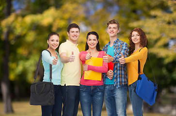 Image showing group of smiling teenagers showing thumbs up