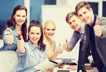 Image showing students with computer monitor and tablet pc