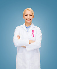 Image showing smiling female doctor with cancer awareness ribbon