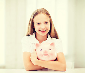 Image showing child with piggy bank