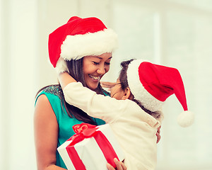 Image showing happy mother and child girl with gift box