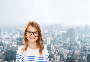 Image showing smiling cute little girl with black eyeglasses