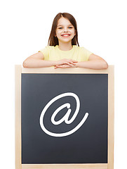 Image showing happy little girl with blackboard