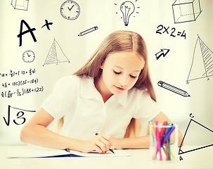 Image showing little student girl drawing at school