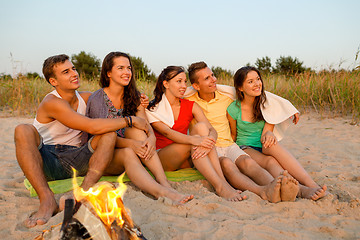 Image showing smiling friends in sunglasses on summer beach