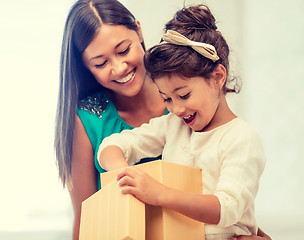 Image showing happy mother and child girl with gift box