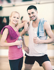 Image showing two smiling people in the gym