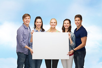 Image showing group of standing students with blank white board