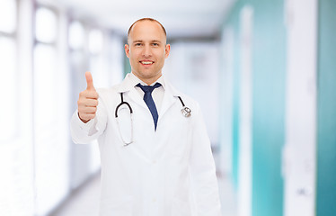 Image showing smiling doctor with stethoscope showing thumbs up