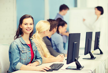 Image showing smiling teenage girl with classmates and teacher