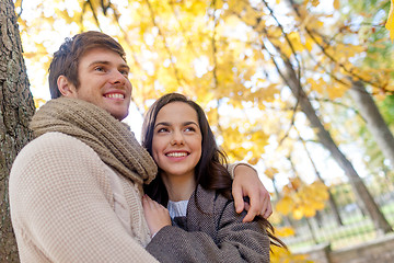 Image showing smiling couple hugging in autumn park