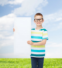 Image showing smiling boy in eyeglasses with white blank board