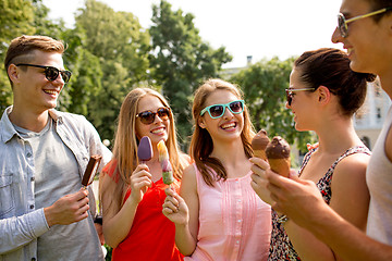 Image showing group of smiling friends with ice cream outdoors