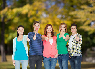 Image showing group of smiling students showing thumbs up