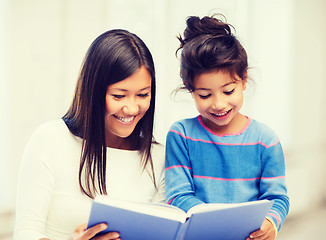 Image showing mother and daughter with book