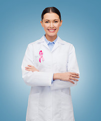 Image showing smiling female doctor with cancer awareness ribbon