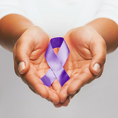 Image showing hands holding purple awareness ribbon