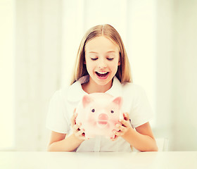 Image showing child with piggy bank