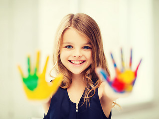 Image showing smiling girl showing painted hands