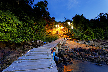 Image showing boat pier and small house at night