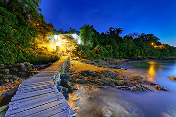 Image showing boat pier and small house at night