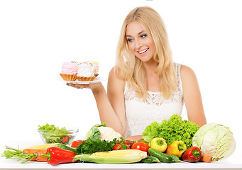 Image showing Woman with vegetables and cake