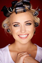 Image showing Beautiful blond with her hair in curlers