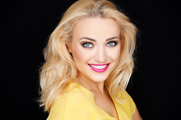 Image showing Smiling beautiful blond woman wearing makeup