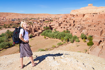 Image showing Traveler in front of  Ait Benhaddou, Morocco.