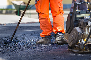 Image showing Asphalt surfacing manual labor.