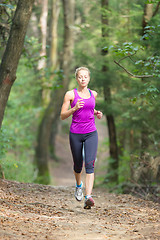 Image showing Pretty young girl runner in the forest. 