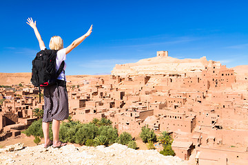 Image showing Traveler arms reised in front of Ait Benhaddou, Morocco.