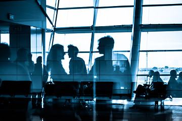 Image showing People traveling on airport silhouettes