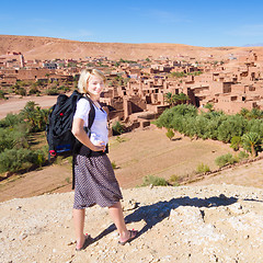 Image showing Traveler in front of  Ait Benhaddou, Morocco.